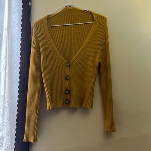 I am selling a yellow cardigan.